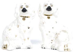 A Pair Royal Doulton Small Staffordshire Seated Spaniels on white ground having gilt decoration,