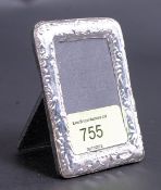 An Edwardian style white metal 925 silver easel backed photograph frame.