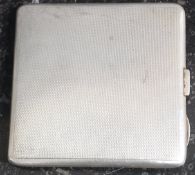 A William Neale hallmarked silver cigarette case, with chase engraved design. Hallmarks to inner.