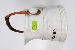 A George Jones designed hot water jug - stamped to the underside with the GJ Crescent.