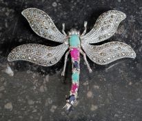 A silver and marcasite dragonfly brooch, set with rubies.
