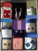 A collection of 9x silver and white metal 925 ladies earrings. Each within a presentation box.