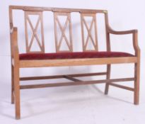 An Edwardian Arts & Crafts hall settle bench.