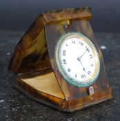 A tortoiseshell (faux) cased pocket watch.