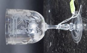 A fine Edwardian crystal glass having etched decoration with cut glass stem on terraced base.