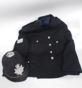 A vintage / retro Policemans Jacket and Helmet,