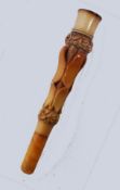 A vintage cased carved bone ? Cheroot holder retaining original case with retailers stamp for Elias