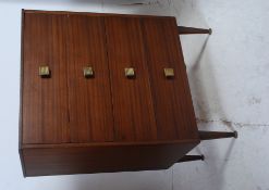 A retro 1970's teak wood chest of drawers,