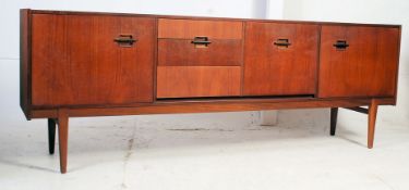 An excellent Danish teak wood 1970's sideboard raised on angular tapered legs with a series of