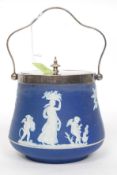 A Wedgwood blue and white jasperware cameo adorned biscuit barrel having silver plate lid,