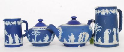 A Wedgwood England Jasperware teapot together with sugar bowl and creamer along with another jug