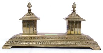A 19th century brass desk top tidy inkwell.