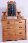 An Edwardian satinwood dressing chest, shaped mirror,