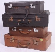 A collection of vintage suit cases to include a set of three matching graduating cases.