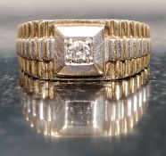 A large 9ct gold single stone diamond ring - gentlemans signet ring of unusual design.