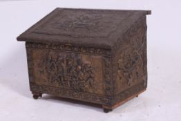 A vintage 1960's decorative embossed brass panelled coal box with hinged top and lined interior