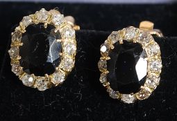 An impressive yellow gold sapphire and diamond set of earrings.