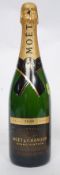 An unopened bottle of Moet & Chandon Grand Vintage 2000 champagne Brut.