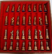 A contemporary case metal and leather boarded chess set.