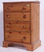A contemporary pine chest of drawers being raised on bracket feet with knob handles to each drawer.