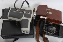 A vintage Butchers Popular Watch Pocket Carbine bellows camera together with lots of photographic