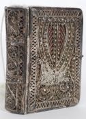 A silver 19th century filigree worked miniature bible of continental / German origin.