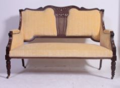 A Victorian rosewood, mahogany and marquetry inlaid salon two seat sofa settee.