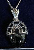 A white metal silver and onyx set pendant necklace