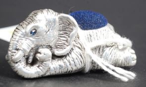 An antique style silver pin cushion in the form of an elephant.