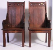 A good pair of 19th century eclesiastical hall chairs made of solid oak raised on cross legs with