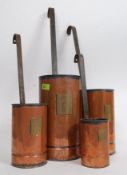 A collection of vintage copper milk measures