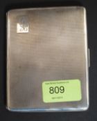 A silver hallmarked  cigarette case with monogram cartouche.