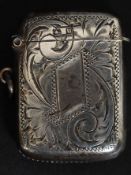 A hallmarked silver vesta being chase decorated, hinged top,