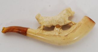 A carved meerschaum cheroot holder in the form of a dog presented in it's original case