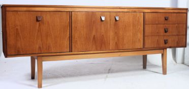 A good quality vintage mid 20th century teak sideboard in the Danish style having three drawers to
