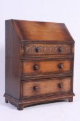 An excellent quality solid oak Jacobean revival bureau.