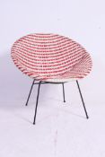 A retro vinyl weave chair, complete on original tubular metal base. Measures: 70 x 70 x 50.