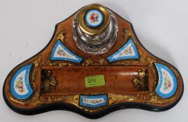 A mid 19th century fruit wood desk stand, having applied Sevres style plaques and ink pot.