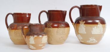 A collection of Doulton Lambeth stoneware jugs having hunting scenes with stag and dogs,