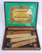 A mahogany box containing a variety of Rabone rulers, measures, levels etc.