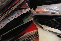 A collection of 45rpm vinyl records mainly from the 1980's to include Nick Lowe, Madness,