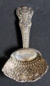 An 18th century silver hallmarked George 3rd caddy spoon / trowel being cast in relief with flowers