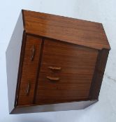 A 1970's G-Plan teak wood corner desk secretaire having fall front drawer pull put desk over
