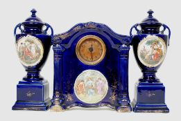 An Edwardian Royal blue and gilt ceramic clock garniture,