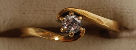 An 18ct gold and single stone diamond ring being suspension set having central diamond approx 15pts.