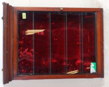 A 19th century mahogany and velvet lined apocathery - shop display cabinet having red velvet