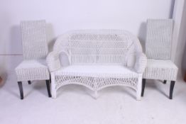 A vintage 20th century whicker painted conservatory 2 seat sofa in the style of Lloyd Loom.