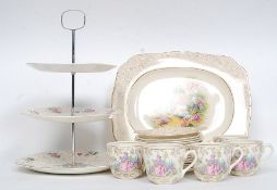 A vintage Staffordshire crinoline lady part tea service together with a chintz pattern similar