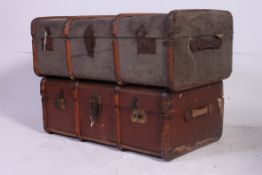 2 vintage 20th century canvas and leather bound steamer trunks, one with monogram to centre.