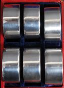 A set of 6 cased silver hallmarked napkin rings by Turner & Simpson bearing Birmingham hallmarks
